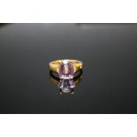 A HALLMARKED 9K GOLD AMETHYST AND DIAMOND RING, coming with certificate stating the cushion cut