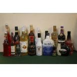 18 BOTTLES OF ASSORTED ALCOHOLIC BEVERAGES TI INCLUDE 1 BOTTLE OF SMIRNOFF GOLD