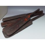 A COLLECTION OF FOUR SMALL VINTAGE STYLE WOODEN PADDLES, largest L 82 cm