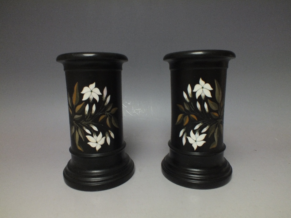 A PAIR OF DERBYSHIRE PIETRA DURA CYLINDRICAL VASES, each black slate classical vase with inlaid