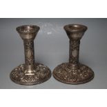 A PAIR OF HALLMARKED SILVER 'GREEN MAN' TYPE CANDLESTICKS BY B&Co - BIRMINGHAM 1986, having filled