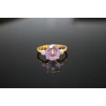 A HALLMARKED 9K GOLD AMETHYST AND DIAMOND RING, the circular amethyst measuring approx 9 mm in