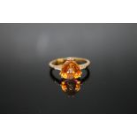 A HALLMARKED 9K GOLD TRILLIANT CUT PADPARADSCHA QUARTZ AND DIAMOND RING, coming with certificate