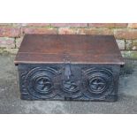 AN ANTIQUE CARVED BIBLE BOX, the hinged lid with original clasp, carved detail to the front, H 23