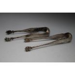 TWO PAIRS OF CONTINENTAL SILVER SUGAR BOWS, one marked A 800, of plain form with paw feet bowls, the