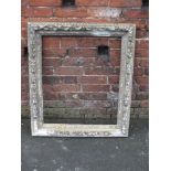 A 19TH CENTURY GILTWOOD CARVED PICTURE FRAME, floral moulded detail, rebate 73 x 62 cm A/F