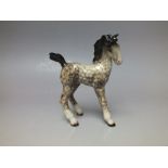 A BESWICK COMICAL TYPE FOAL IN ROCKING HORSE GREY COLOURWAY, model number 728