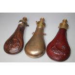 THREE EARLY POWDER FLASKS, largest L 18 cm