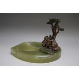 AN ART DECO ONYX PIN DISH WITH CAST RABBITS BENEATH A TREE, the rabbit group with painted