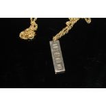 A HALLMARKED GOLD INGOT, on gold plated chain, weight of ingot approx 14.3g