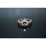 A HALLMARKED 9K WHITE GOLD CUSHION CUT AAA TANZANITE RING, coming with certificate stating stone