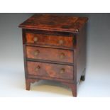 A GEORGIAN MINIATURE / APPRENTICE FLAME MAHOGANY CHEST OF THREE DRAWS, the body of the chest being