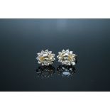 A PAIR OF 10K OURO PRATO IMPERIAL YELLOW TOPAZ EARRINGS, the oval stones set in white gold and
