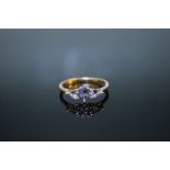 A HALLMARKED 9K GOLD TRIPLE PEAR SHAPED TANZANITE RING, ring size U