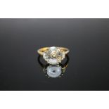 A HALLMARKED 9K GOLD SKY BLUE TOPAZ AND DIAMOND RING, coming with certificate that states the