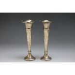 A PAIR OF CHESTER HALLMARKED SILVER TRUMPET VASES, one dated 1914, the other 1915, with fluted