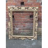A LATE 18TH /EARLY 19TH CENTURY GILTWOOD FLORENTINE STYLE PICTURE FRAME, of rectangular outline,