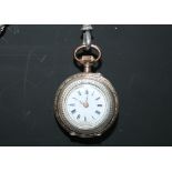 A VICTORIAN SILVER LADIES POCKET WATCH WITH SILVER ALBERTINA CHAIN, having white enamel dial,
