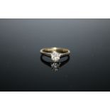 AN 18 CT GOLD AND PLATINUM DIAMOND SOLITAIRE RING, the old cut diamond being approx 0.65 carat,