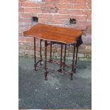 AN ANTIQUE MAHOGANY DROPLEAF TABLE OF SMALL PROPORTIONS, the shaped top raised on 'spider' supports,