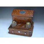 A VICTORIAN OAK STATIONARY CABINET / DESK STAND, with hinged lid to rear, pen holder and two glass