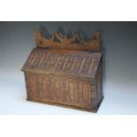 A LATE 18TH / EARLY 20TH CENTURY OAK CANDLE BOX, having carved period decoration to the hinged