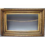 A 20TH CENTURY ART NOUVEAU STYLE GILTWOOD AND GESSO PICTURE FRAME, landscape rebate 56.5 x 28 cm