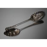 TWO HALLMARKED SILVER BERRY SPOONS, the first being a Scottish example and dated Edinburgh 1790,