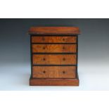 A LATE 19TH / EARLY 20TH CENTURY MINIATURE / APPRENTICE CHEST OF FOUR GRADUATED DRAWERS, the drawers