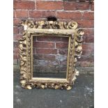 A 19TH CENTURY GILTWOOD FLORENTINE STYLE PICTURE FRAME, of rectangular outline, rebate 45 x 37 cm