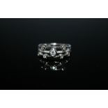 A DESIGNER STYLE SPLIT BAND 18 CARAT WHITE GOLD DIAMOND SET RING, having a approx total of 0.35