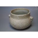 A CHINESE PALE CELADON CRACKLE GLAZED POT, of circular form, with applied handles, H 8 cm