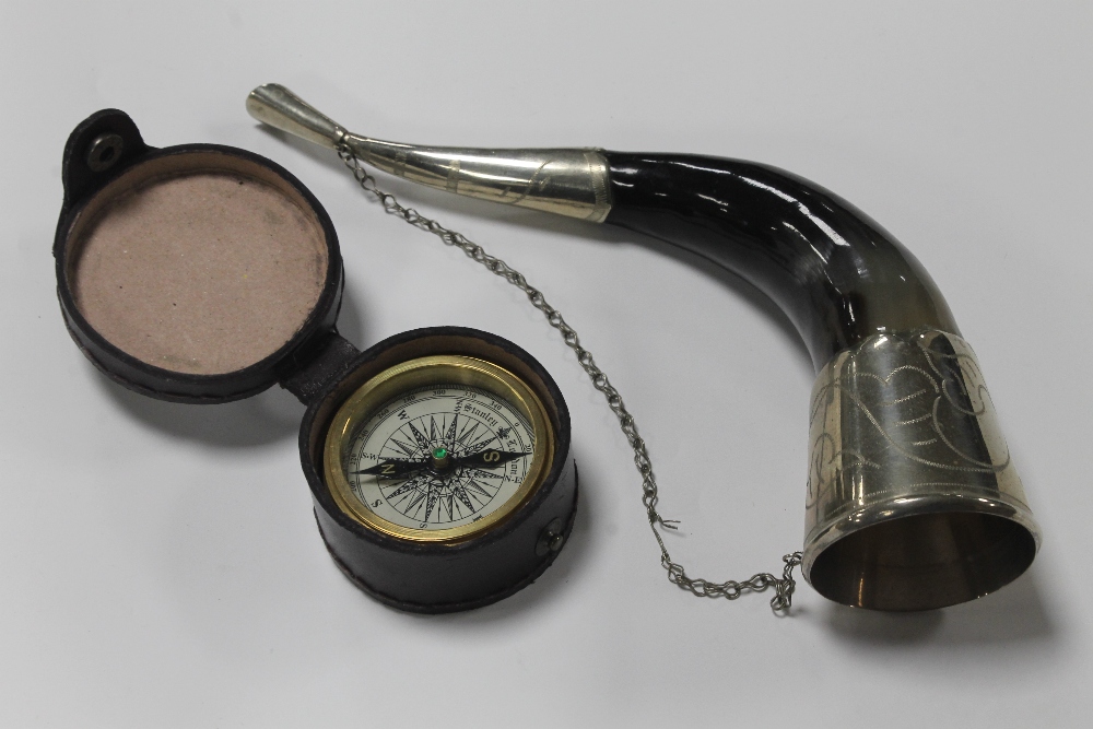 A CASED COMPASS TOGETHER WITH A WHITE METAL HORN