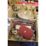 TWO TRAYS OF ASSORTED METALWARE TO INCLUDE CANDELABRA, WHITE METAL TRAY, CASED AND LOOSE FLATWARE,