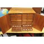 A HOME MADE COIN COLLECTORS CABINET