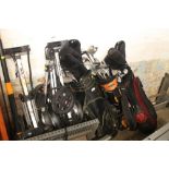 A LARGE QUANTITY OF ASSORTED GOLF CLUBS, TROLLEYS, BAGS, ETC