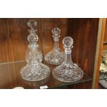 FOUR CUT GLASS DECANTERS