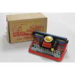 A BOXED METTYPE TIN PLATE TOY TYPEWRITER