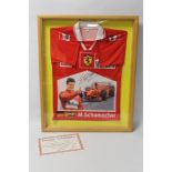 A FERRARI POLO SHIRT SIGNED BY MICHAEL SCHUMACHER AND MOUNTED IN A GLASS FRONTED WALL DISPLAY CASE,