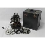 AN EARLY 20TH CENTURY BLACK PAINTED ALEF FILM PROJECTOR, in carry case