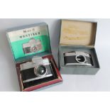 A WRAYFLEX CAMERA A/F, and a spare body, both contained in original card boxes (2)