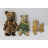 A MOHAIR TEDDY BEAR with jointed body (15") together with another larger bear and two smaller examp