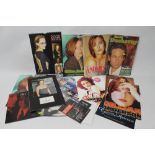 A COLLECTION OF UNUSED X-FILES CALENDARS, together with a mounted photograph of Gillian Anderson wi