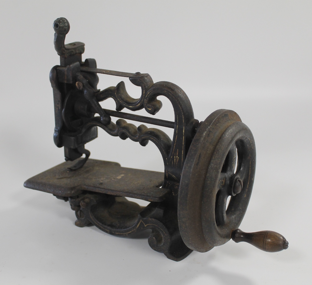 A 19TH CENTURY 'WEIR' TYPE SEWING MACHINE, gilt and black painted surfaces