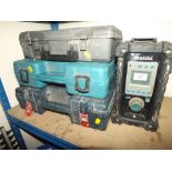 A MAKITA RADIO AND THREE CASED DRILLS