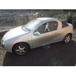 A SILVER VAUXHALL TIGRA COUPE WITH KEYS AND LOG BOOK