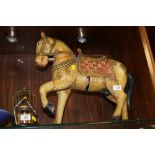 A WOODEN INDIAN HORSE FIGURE