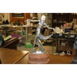 A CAST BRONZED TYPE ART DECO FIGURE OF A LADY WALKING A/F