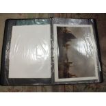 A LEATHER PORTFOLIO CASE CONTAINING A QUANTITY OF PRINTS