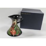 A BOXED MOORCROFT FLEUR DE LUCE DECANTER SHAPE JUG